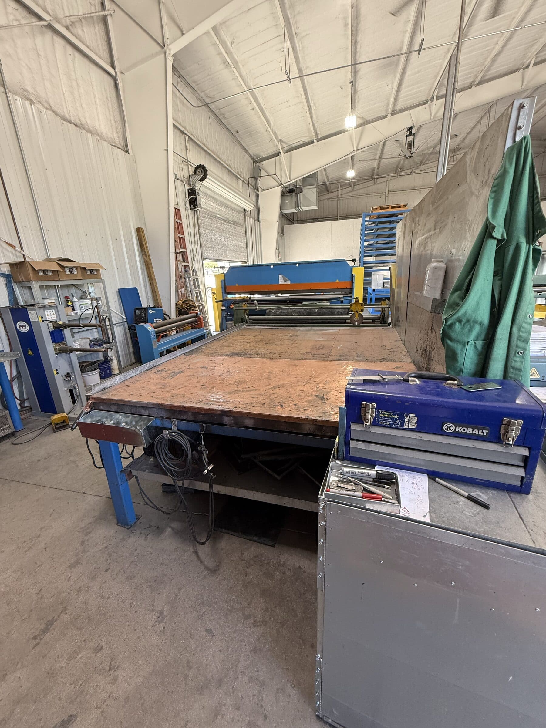 Fabrication worktable aligned with sheet metal forming equipment