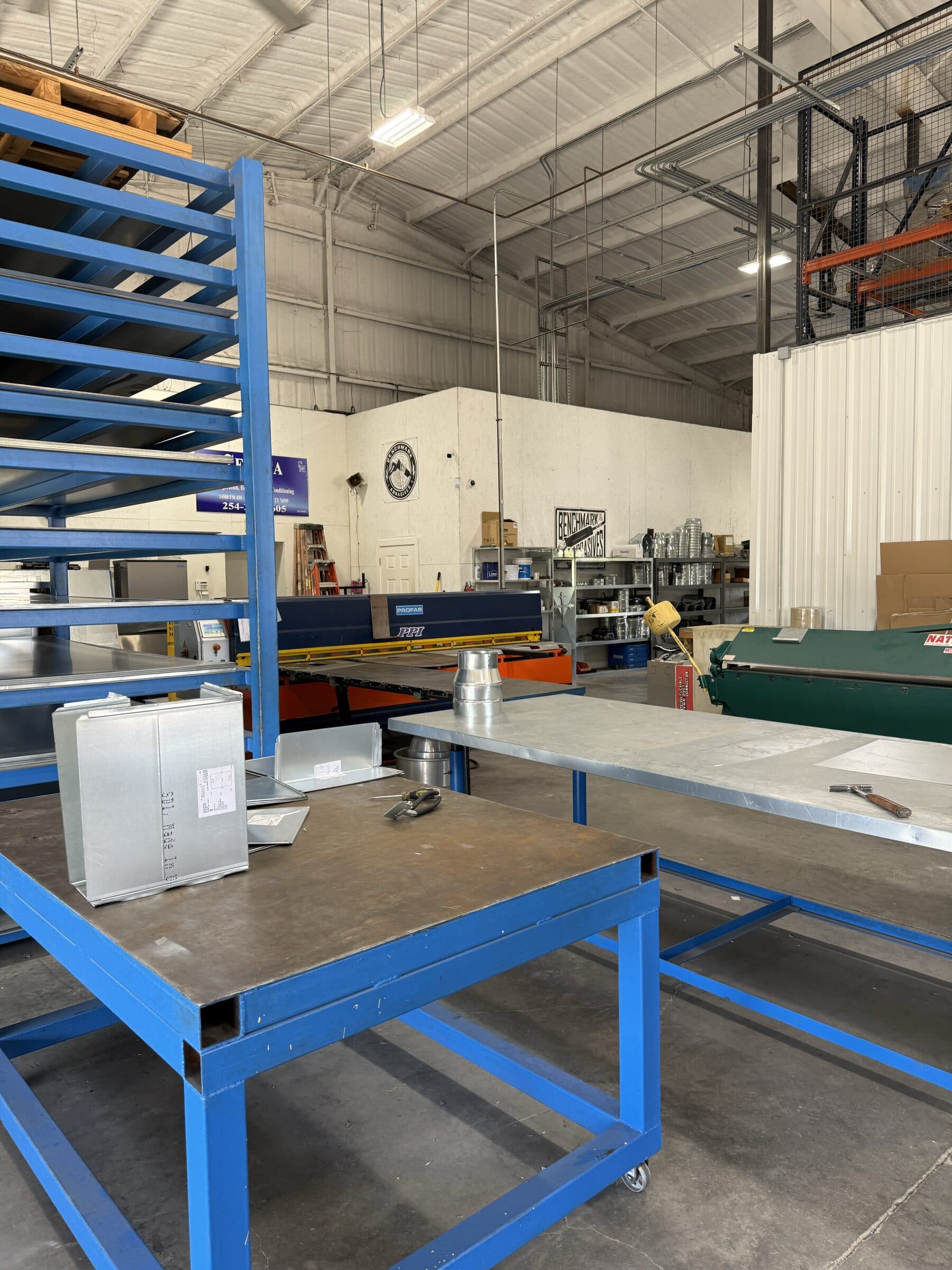 Material rack and worktables inside Seneca's fabrication shop