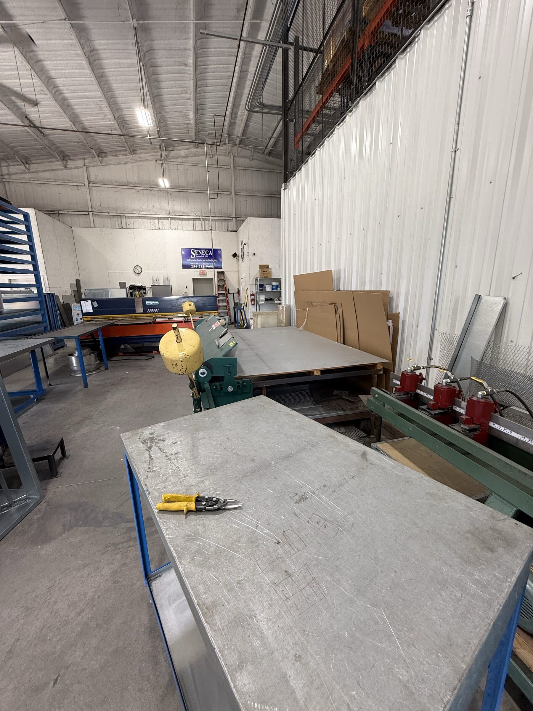 Sheet metal positioned on a layout and fabrication table